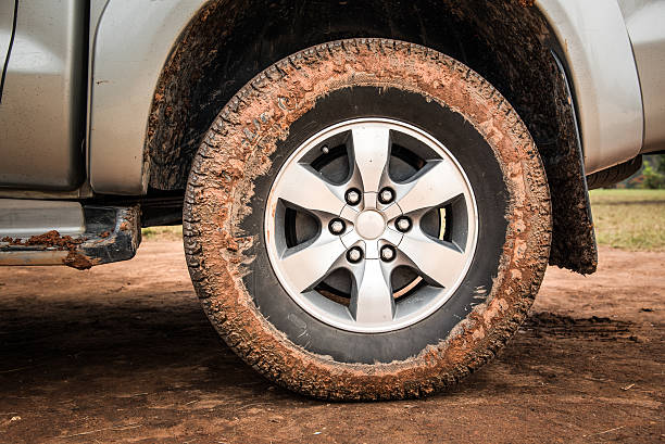Wheel tire mess up with mud and dirt stock photo