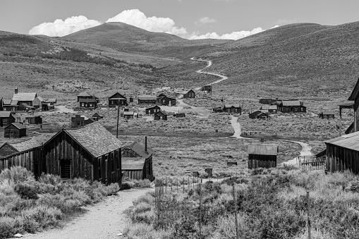 Bodie wild west ghost town at Bodie State Historic park in California's Sierra Nevada Mountains in black and white.