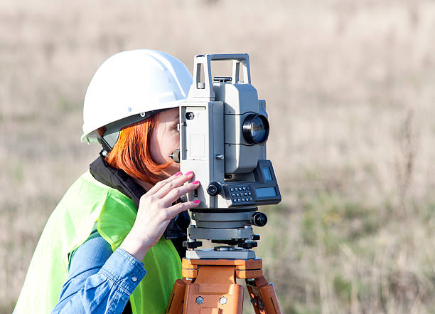istock Female engineer land surveyor 518762116