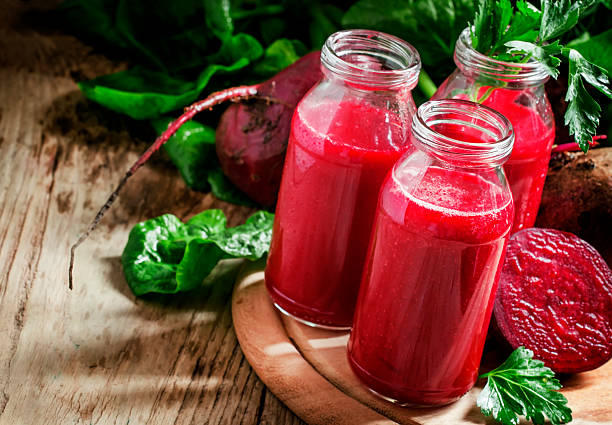 istock Vitamin beetroot smoothie in glass bottles 518763446