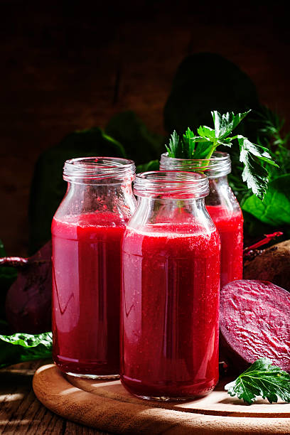 istock Vitamin beetroot smoothie in glass bottles 518763574