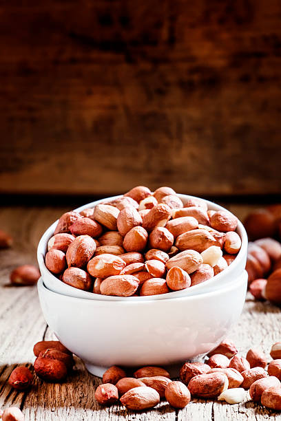 istock Raw peeled peanuts in a white porcelain bowl 518763994