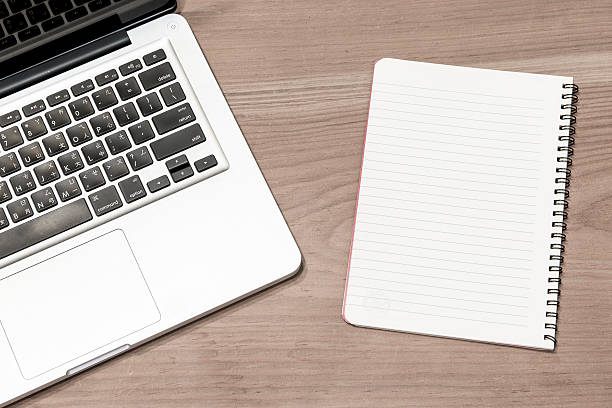 istock Laptop computer on a wooden desk 518775443