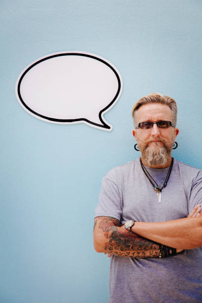 istock Serious hipster with arms crossed and speech bubble 518776062