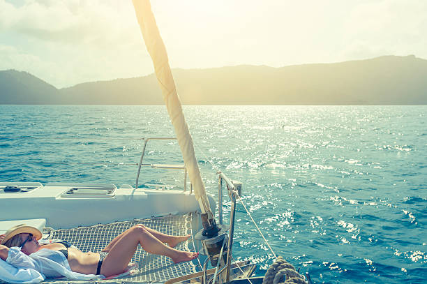 istock Woman relaxing on a sailboat. 518776478