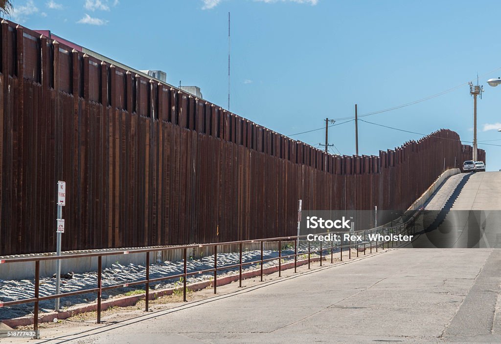 Border fence separating Mexico and the United States Border fence in Nogales Arizona separating the United States from Nogales Sonora Mexico International Border Barrier Stock Photo