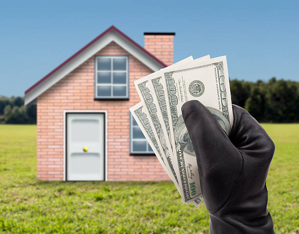 istock stealing dollars a country house 518777644