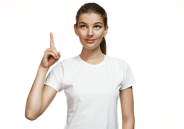 istock Attractive girl pointing up showing copy space 518777661