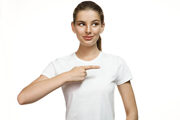 istock Tempting girl with finger point aside 518777663