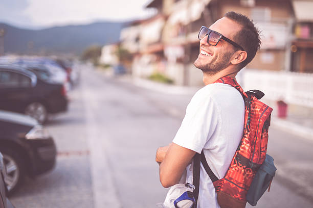 istock Young man going to the beach 518778650