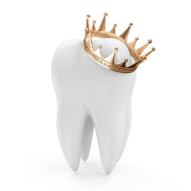 istock Tooth with Golden Crown isolated on white background 518778705