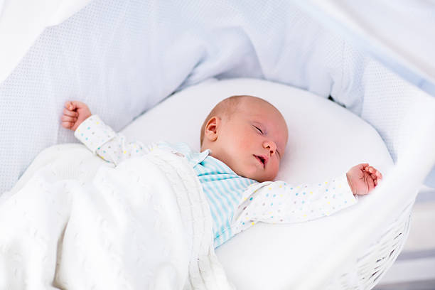 istock Cute newborn baby in white bed 518778816