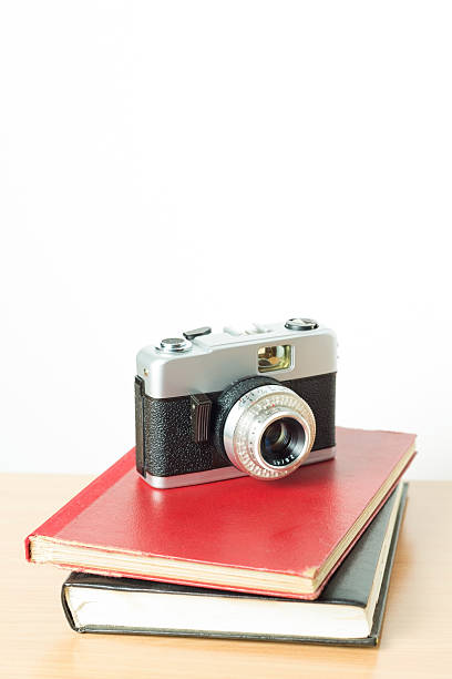 istock Vintage film camera with books 518778959