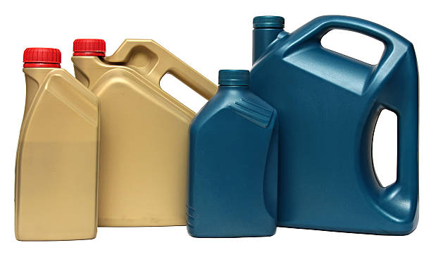 istock Plastic bottles from automobile oils isolated on white background 518780082