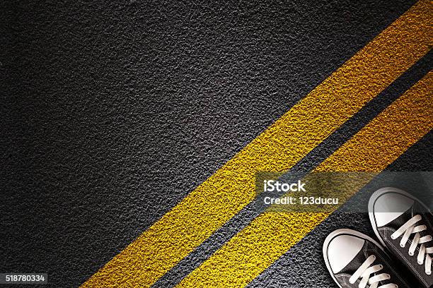 Man Standing On The Yellow Line Stock Photo - Download Image Now - Boundary, Shoe, Yellow Line - Road Marking