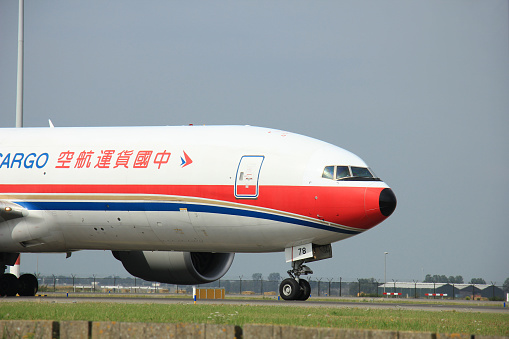 Amsterdam, The Netherlands - August 10 2015: B-2078 China Cargo Airlines Boeing 777F  taxing on the Polderbaan runway to the main terminal of Amsterdam Schiphol Airport