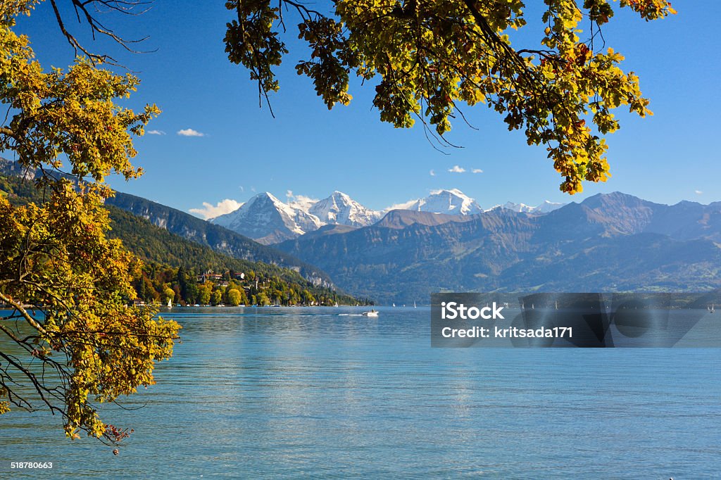 Lake Thun with Jungfrau mountain in autumn  clear blue sky Lake Thun with Jungfrau mountain in autumn on clear blue sky , Switzerland, Shot using CPL  filter Autumn Stock Photo