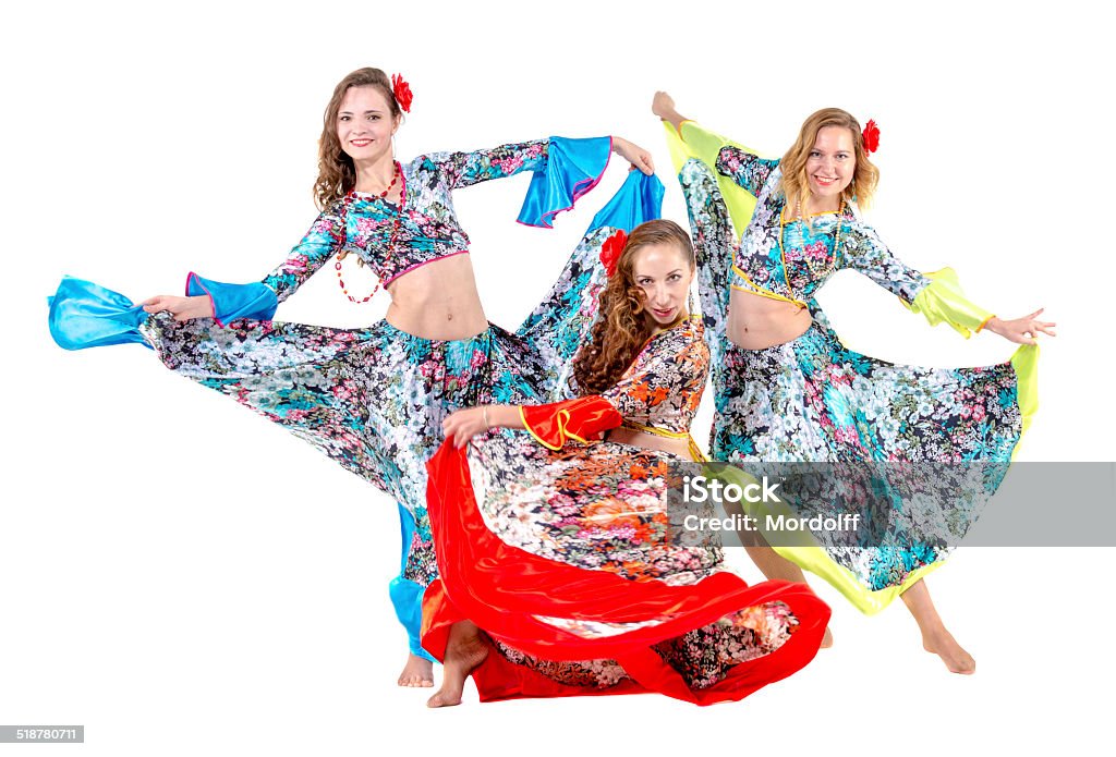 Gypsy women dancing Three attractive women dancing gypsy dance. Isolated on white Activity Stock Photo