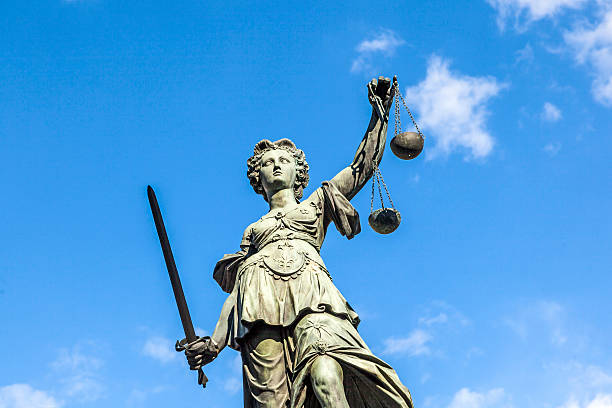 istock Justitia (Lady Justice) sculpture on the Roemerberg  in Frankfurt 518780739