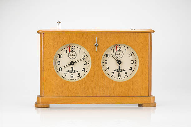 istock Old wooden chess clock isolated on white background 518780853