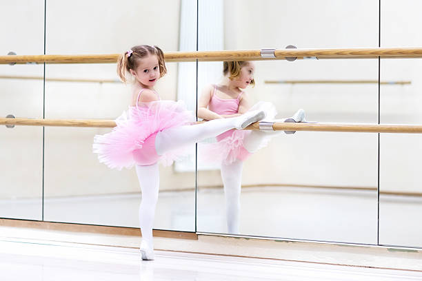istock Little ballerina at ballet class 518781284
