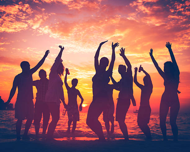 young adult summer beach party dancing concept - beach party stock photos, pictures and images
