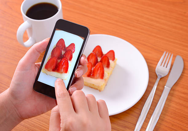 istock Taking food photo with smart phone camera 518797939