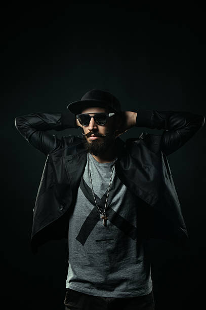 istock Bearded man in cap clasped his hands behind his head 518798123