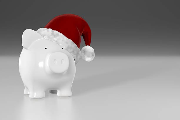 istock Piggy bank - white pig with red santa hat 518799565