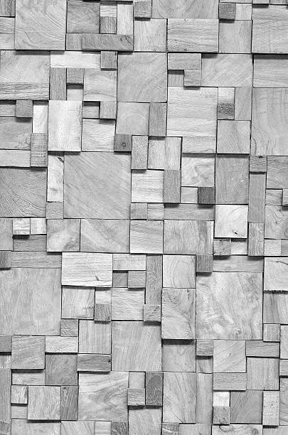 istock Black and white background of irregularly shaped wooden blocks 518800104
