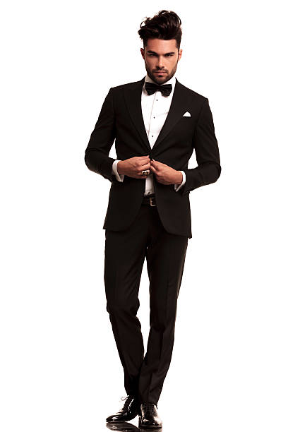 istock elegant man in tuxedo unbuttoning his coat 518800827