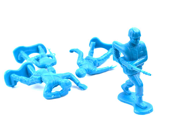 istock Blue army men with fallen soldiers at a 3/4 view 518801462