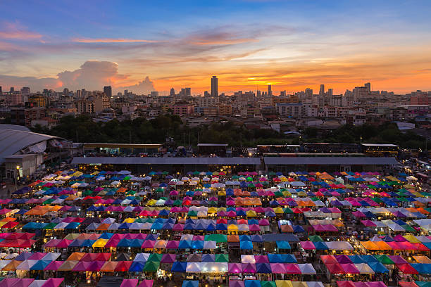 istock Beautiful sky after sunset over Bangkok flea market 518802048