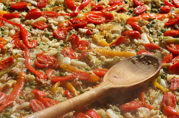 istock spoon on Valencian paella at the spanish restaurant 518803525