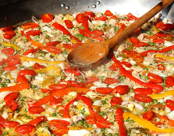 istock spoon on Valencian paella at the spanish restaurant 518803527