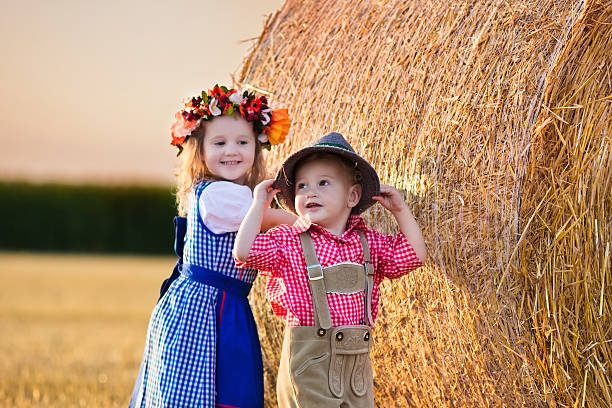istock Kids playing in wheat field in Germany 518804000