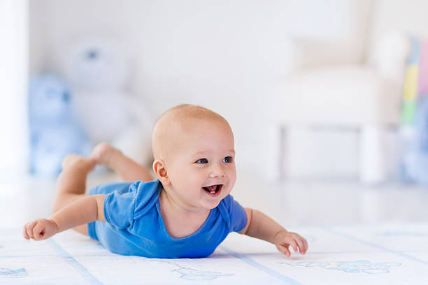 istock Baby boy in white nursery 518804440