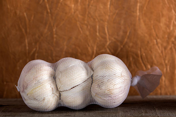 One packaged garlic stock photo