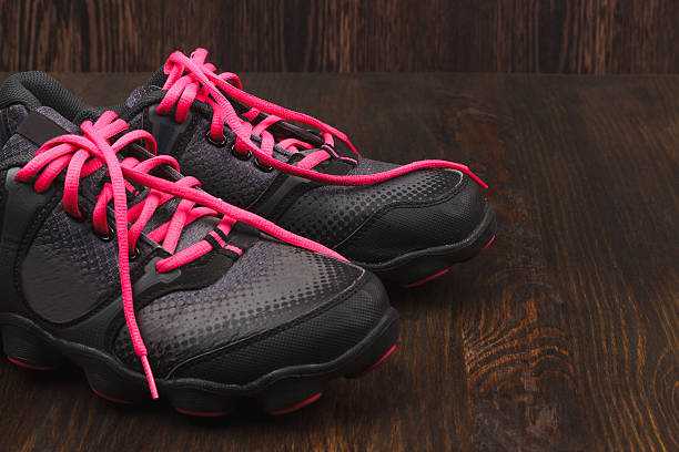 istock Sneakers on the wooden background 518805956