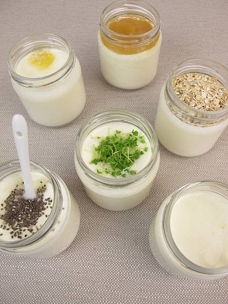 istock Yogurt in jars from yogurt maker with topping 518807534