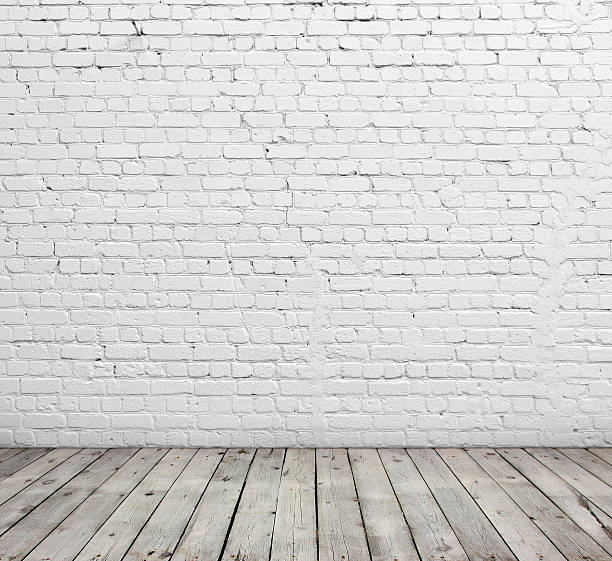 istock White brick wall and wood floor. 518812773
