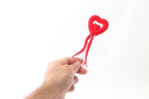 istock Red  heart on man hand 518813466