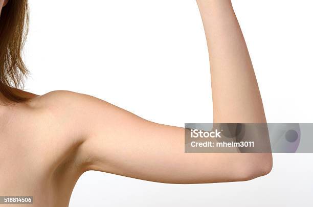 One Woman Bare Shoulder And Arm Bent At The Elbow Stock Photo - Download Image Now - Adult, Aging Process, Beautiful People