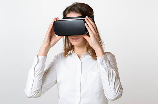 istock Woman holding 3D viewer over face 518814758