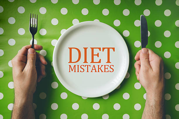 istock Diet mistakes concept, top view of dinning table 518815086