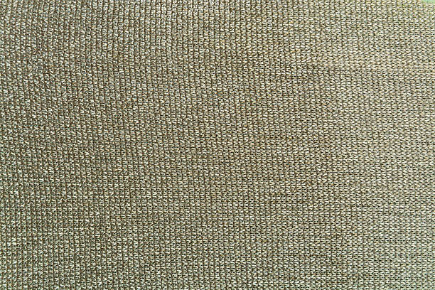 istock The dark beige knitted fabric for background 518815090