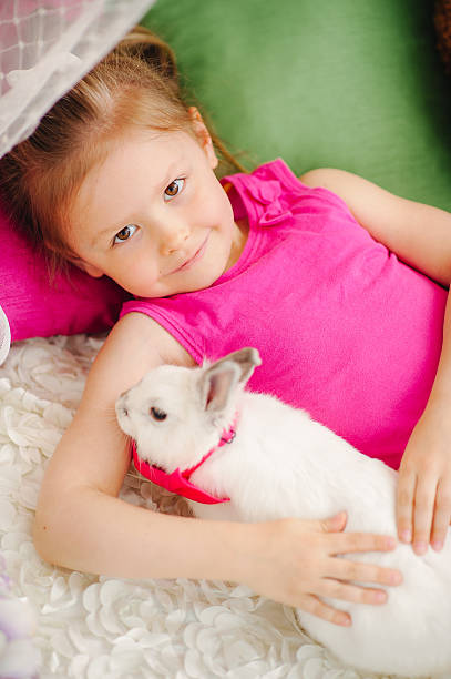 istock The girl and the Easter Bunny 518816364