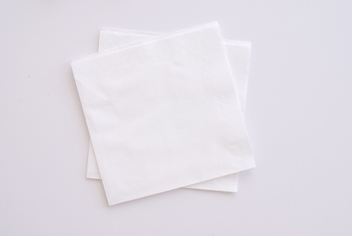 two white napkins on white background - studio shot