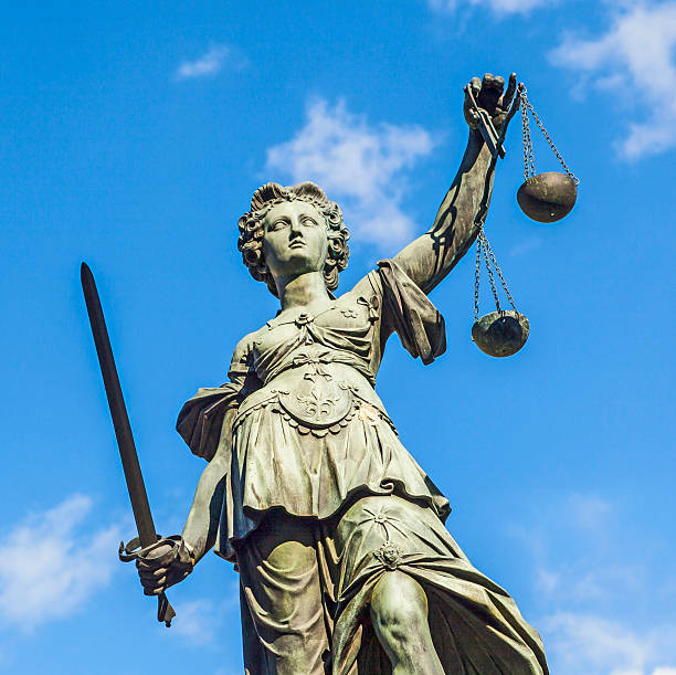 istock Justitia (Lady Justice) sculpture on the Roemerberg  in Frankfurt 518816605