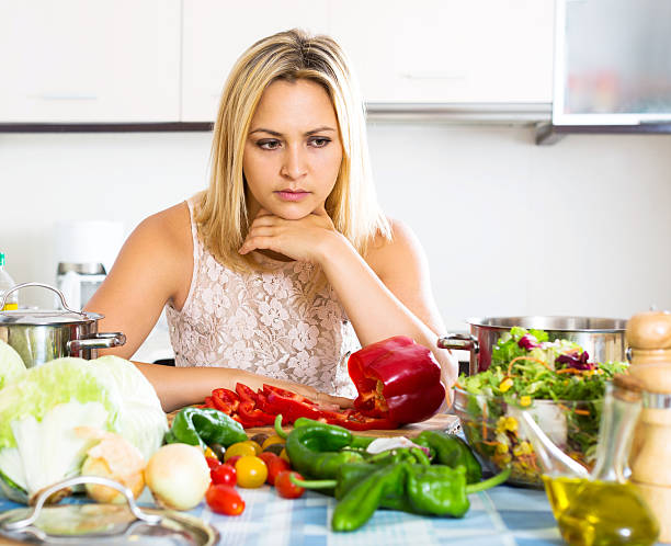 istock Confused housewife in the kitchen 518817256